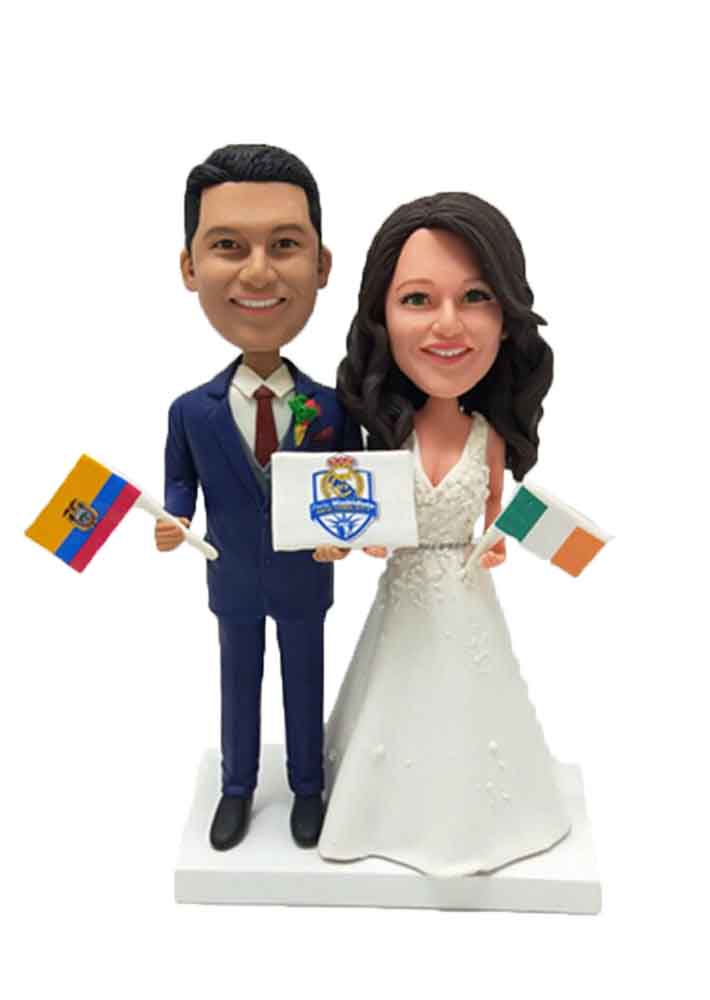 Custom wedding cake topper holding flags