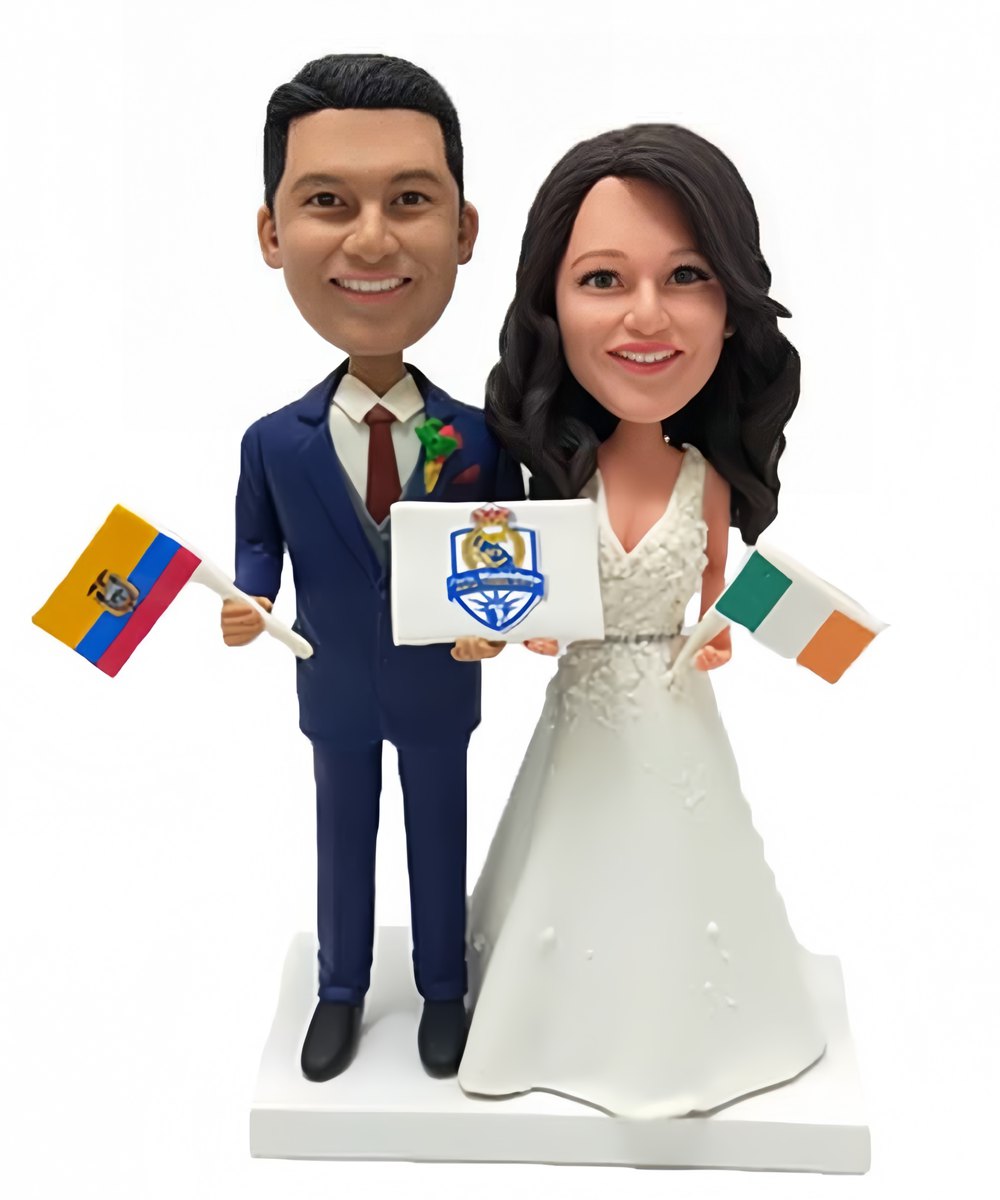 Custom wedding cake topper holding flags