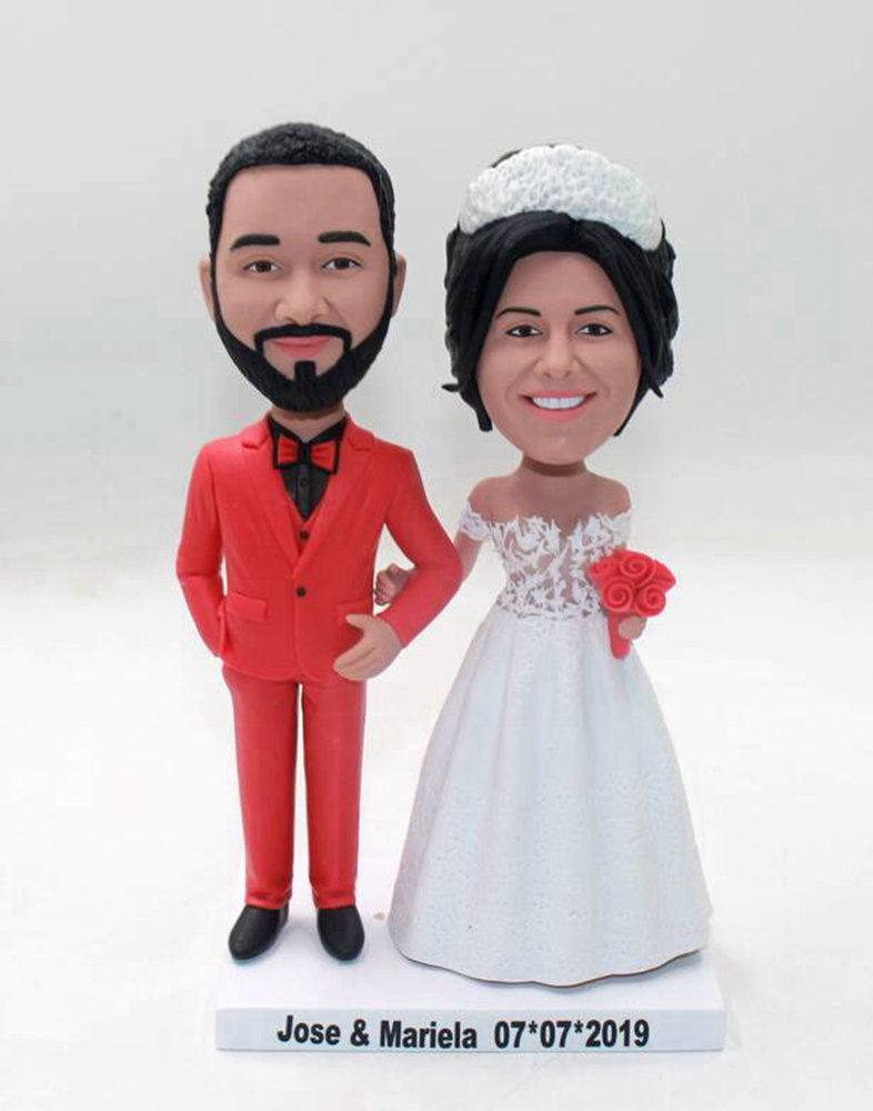 Custom wedding cake topper with red suit and crown