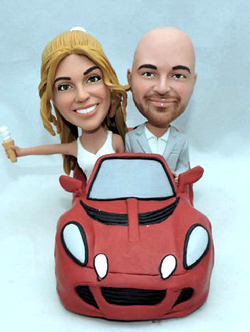 Custom wedding cake topper couple in Lotus sports car
