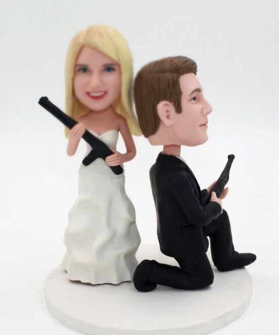 Custom weddding cake topper with guns