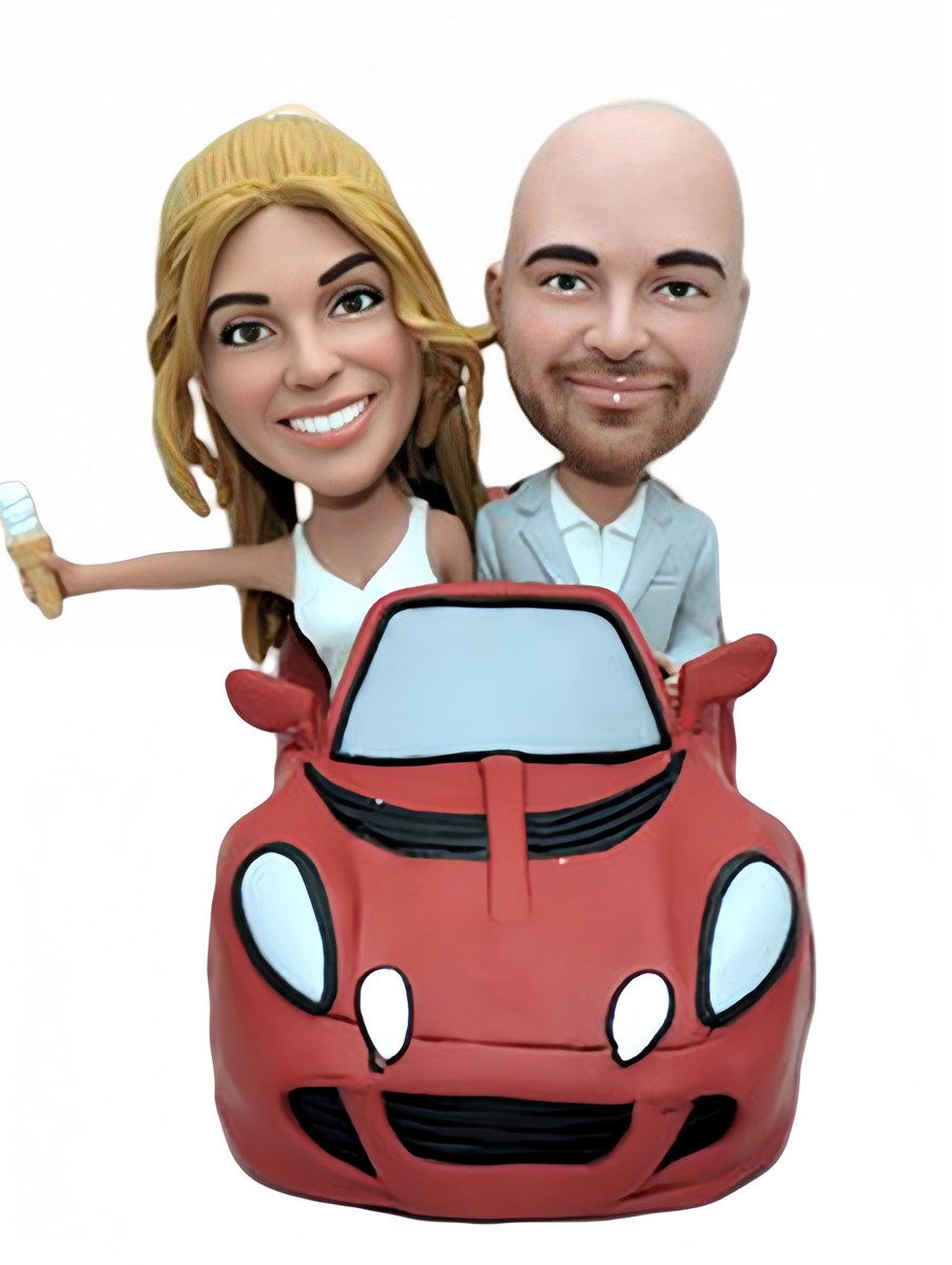 Custom wedding cake topper couple in Lotus sports car