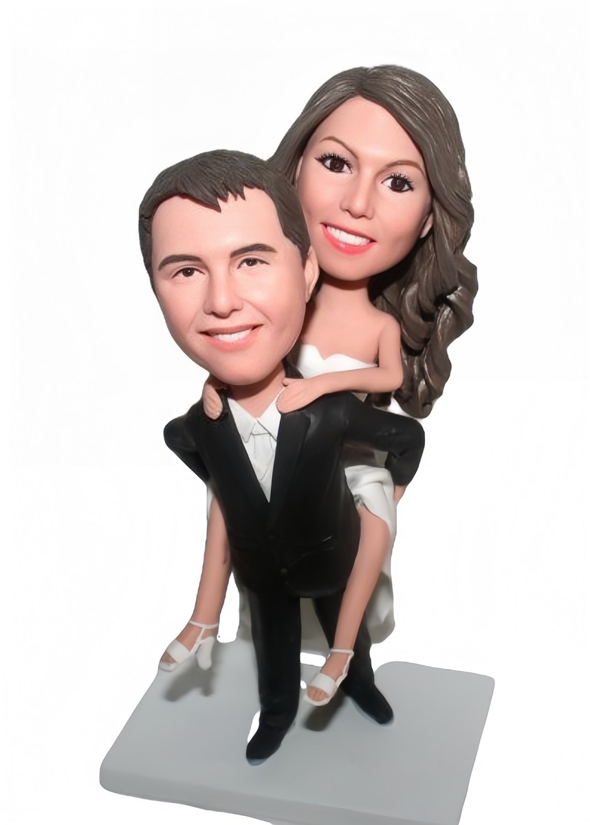 Custom cake topper groom carrying bride wedding figurines